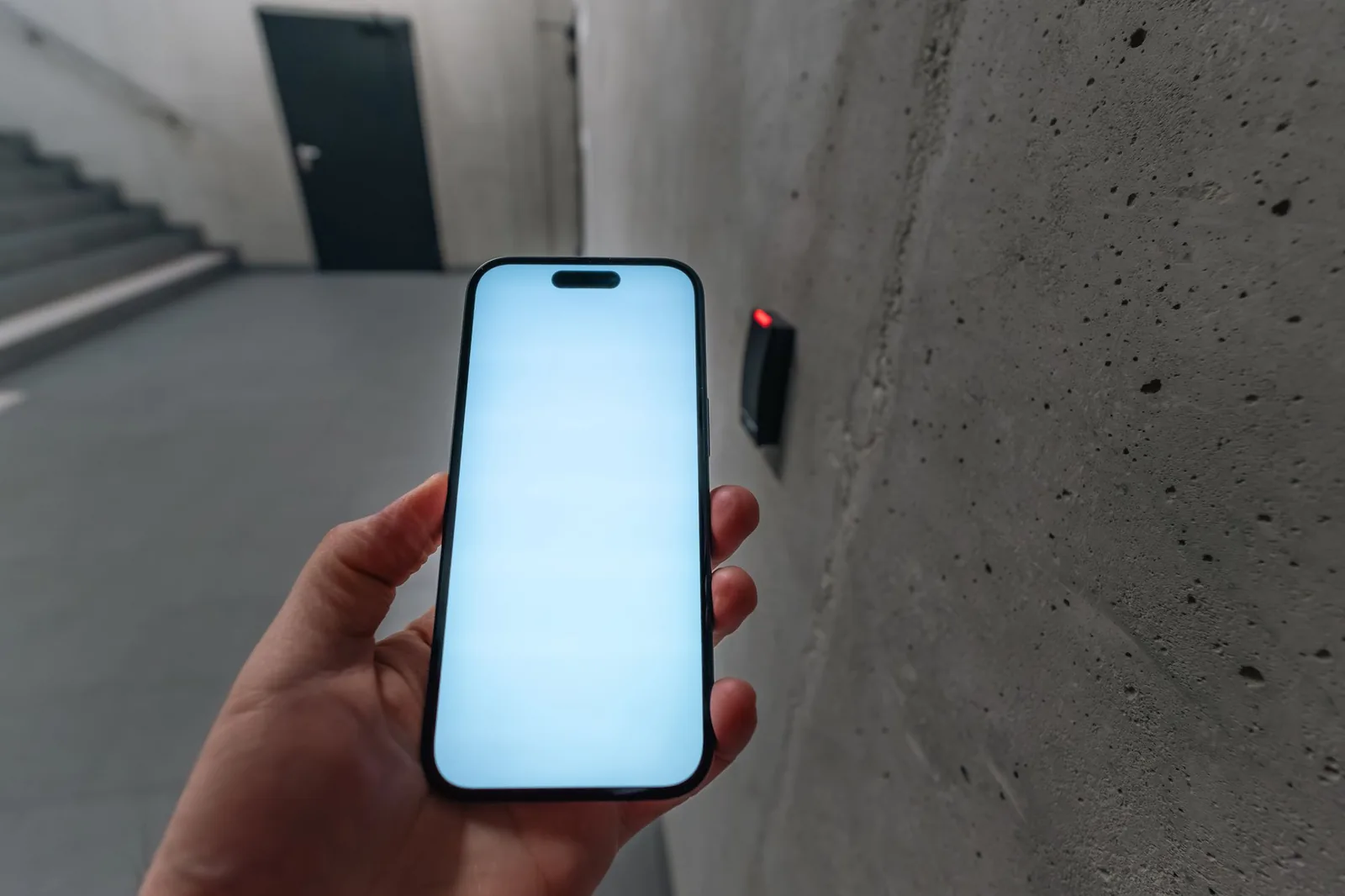 Mobile credential held to a wall access reader