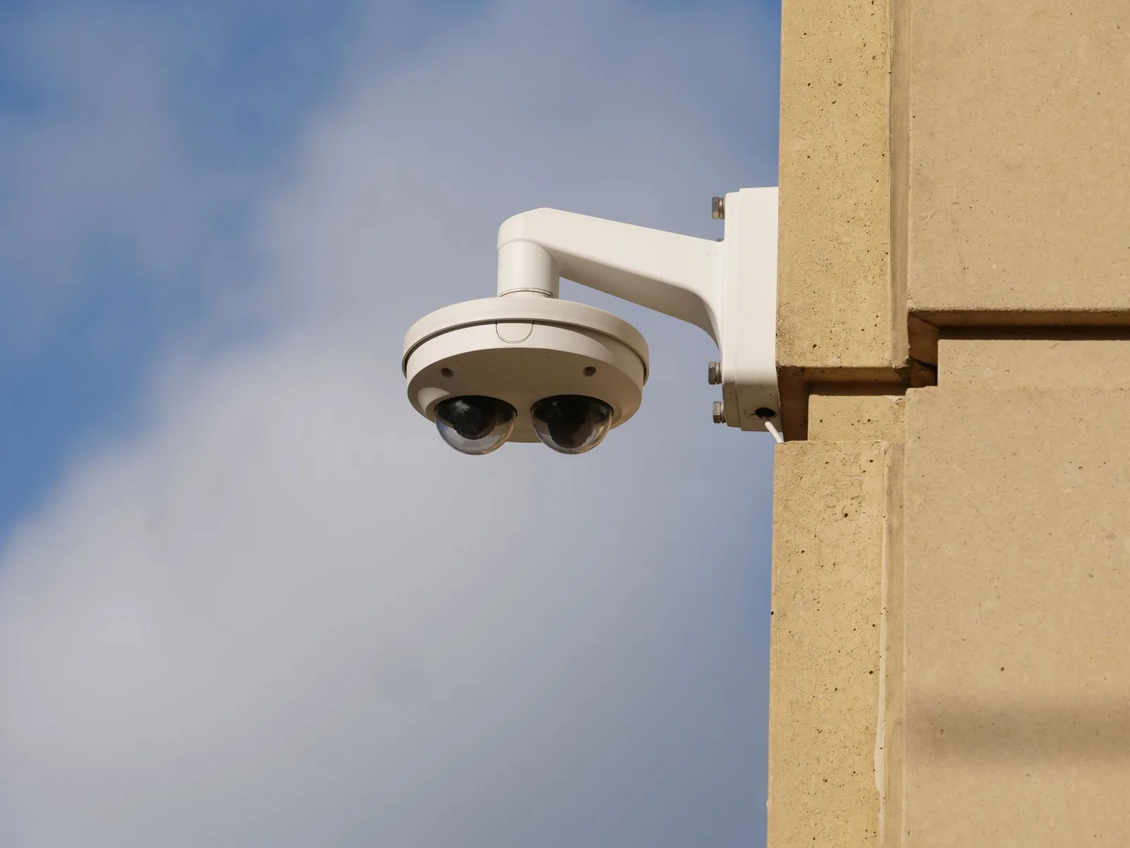 Outdoor bullet CCTV camera on a building façade
